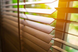 Wooden blinds with sun light.
