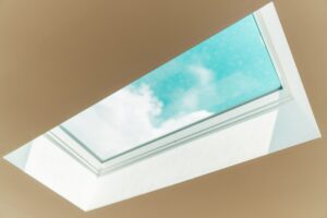 white skylight window with blue sky